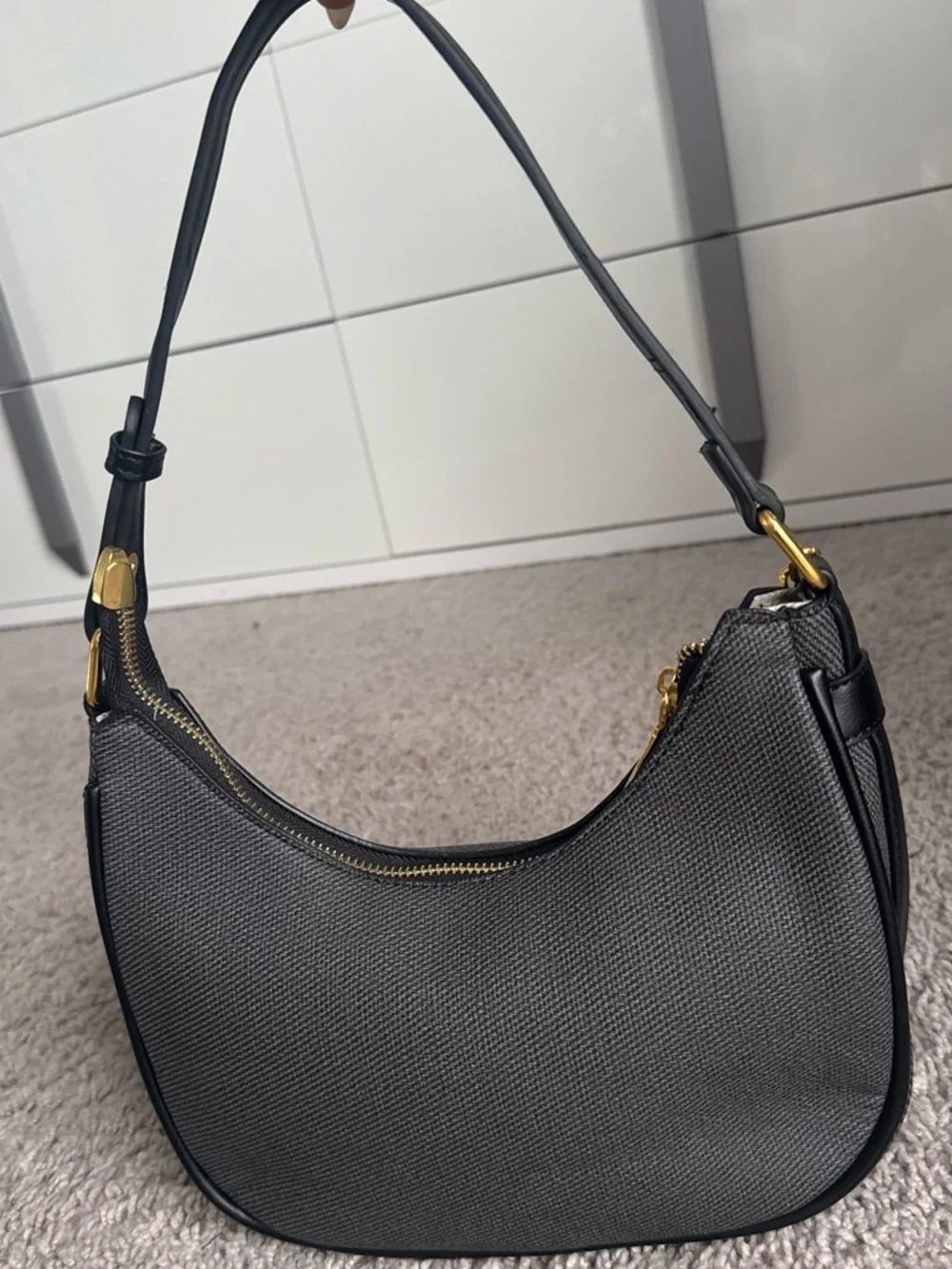 Black Crescent Shoulder Bag with Gold Chain Accent